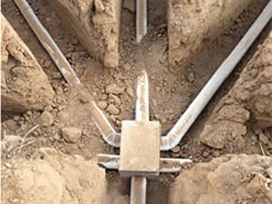 Septic distribution pipes branching into multiple trench lines Septic distribution pipes branching into multiple trench lines