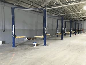 Structural and underground system components inside an industrial facility Industrial facility with vertical steel support structures and underground utility connections