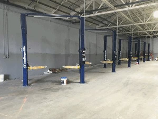 Structural and underground system components inside an industrial facility Industrial facility with vertical steel support structures and underground utility connections